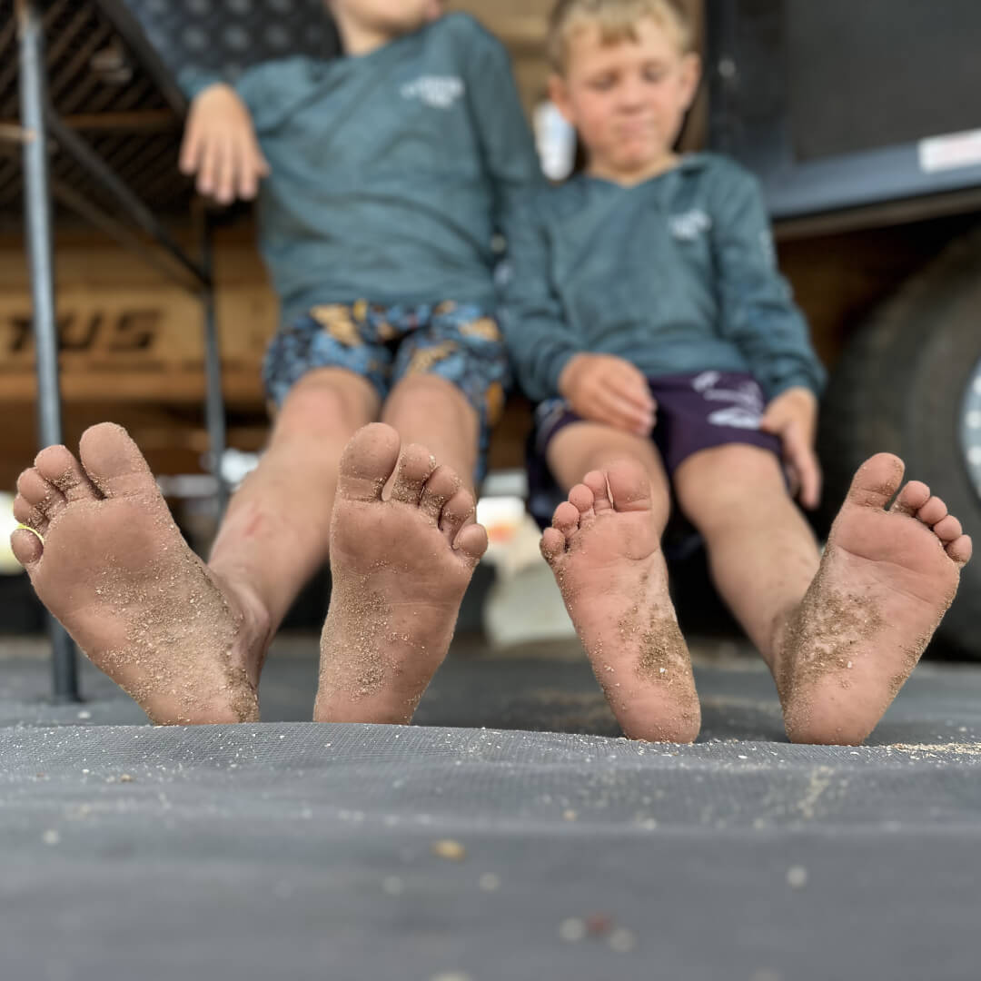kids tracking sand and dirt into caravan without a door mat
